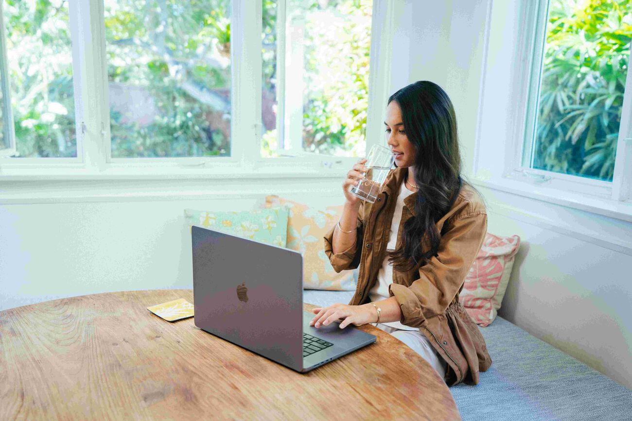 Woman sitting in front of her laptop